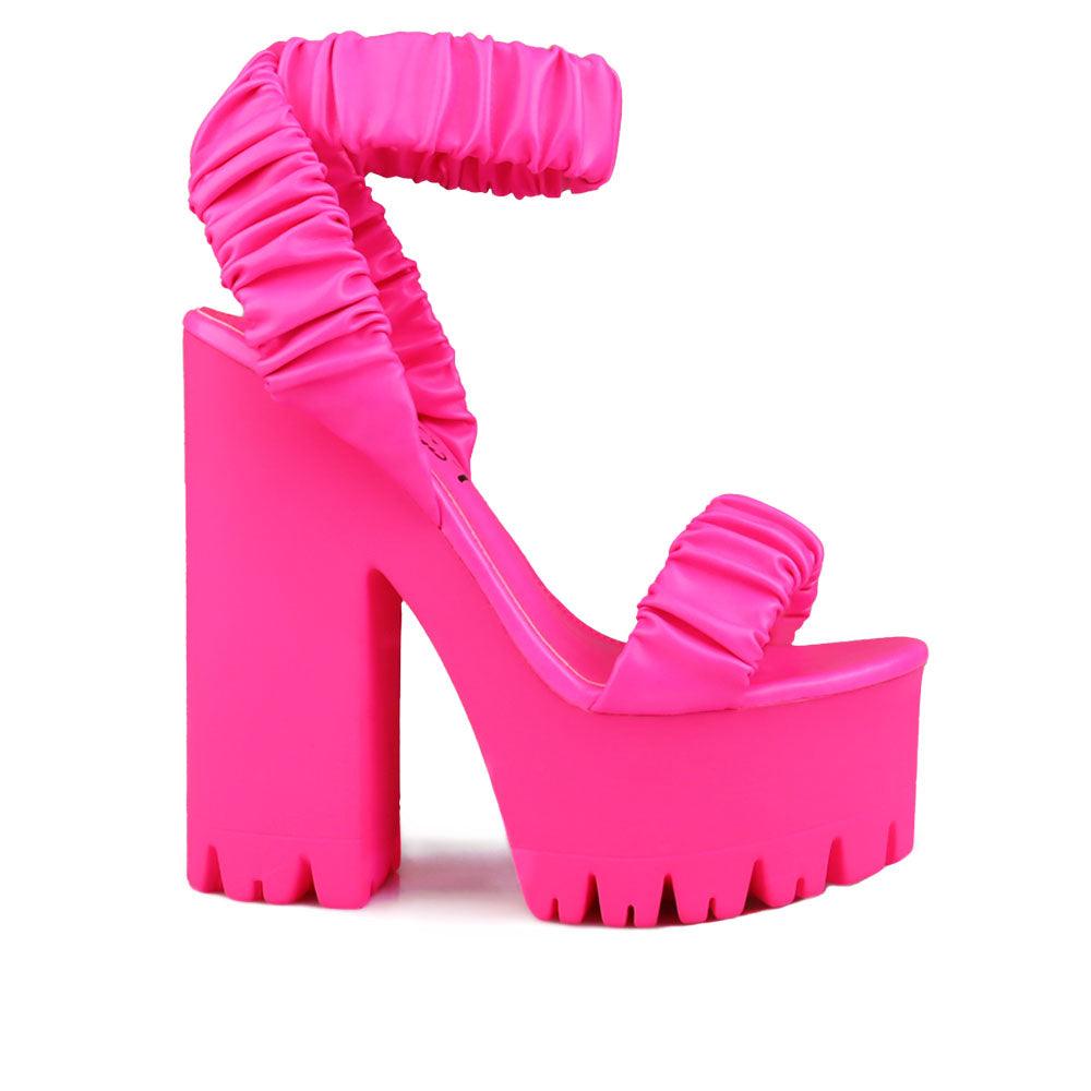 Women platform heels with velcro strap in neon pink-side view