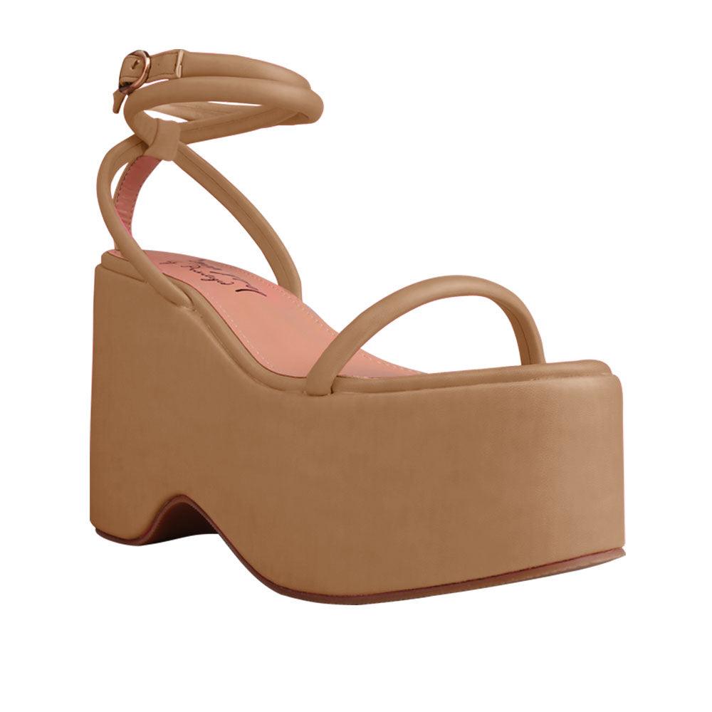 Nude colored women platforms with strappy ankle buckle closure-corner view