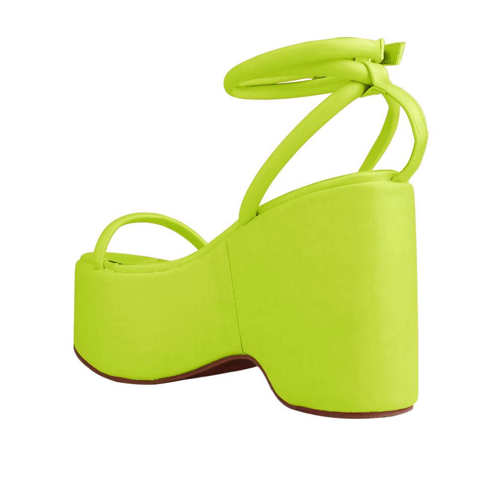 Green colored women platforms with strappy ankle buckle closure-posterior view