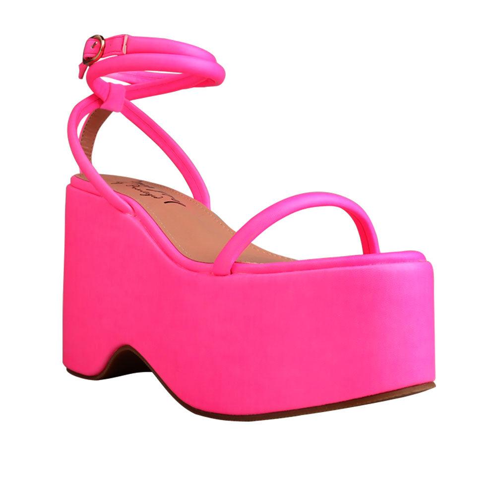 Pink colored women platforms with strappy ankle buckle closure-corner view