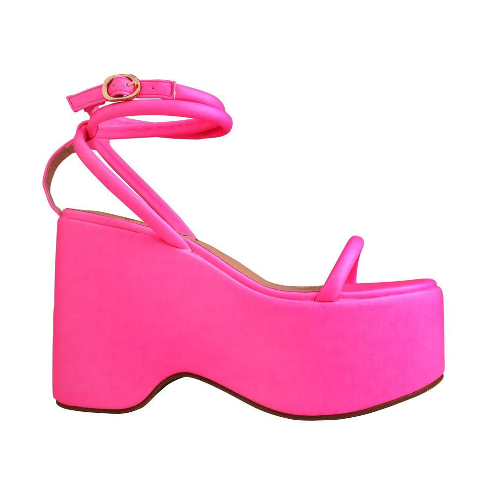 Pink colored women platforms with strappy ankle buckle closure-side view