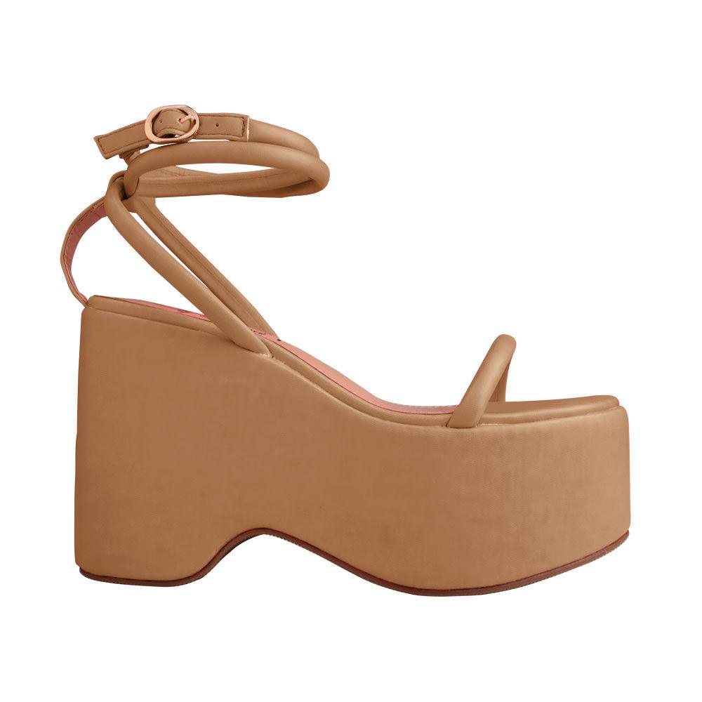 Nude colored women platforms with strappy ankle buckle closure-side view