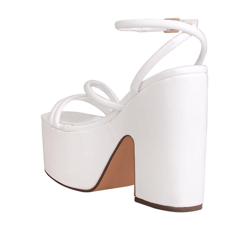 White colored women platform heels with ankle buckle closure-posterior view