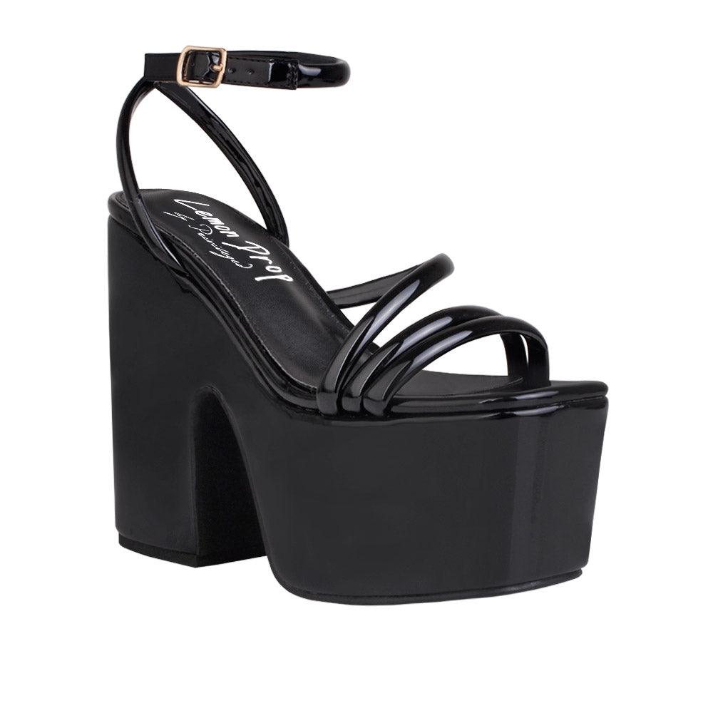 Black colored women platform heels with ankle buckle closure-corner view