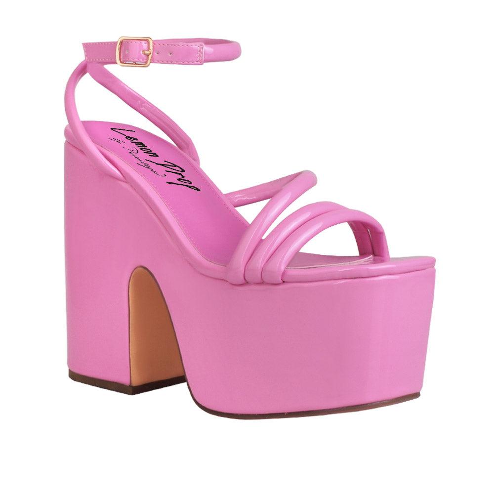 Pink colored women platform heels with ankle buckle closure-corner view