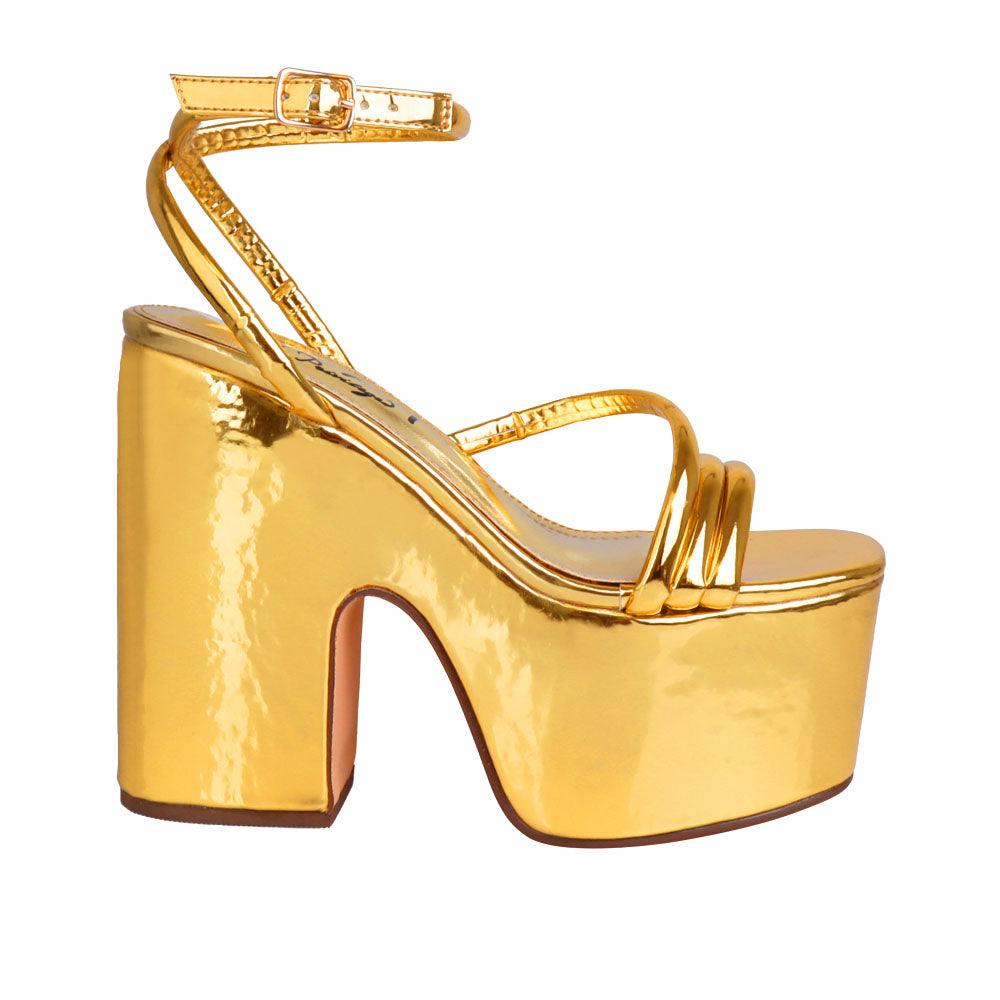 Golden colored women platform heels with ankle buckle closure-side view