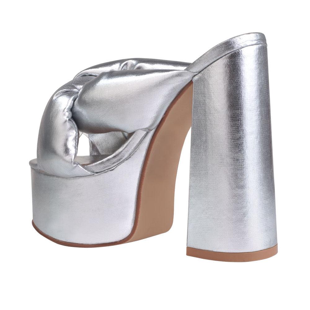 Silver colored fur women platforms-posterior view