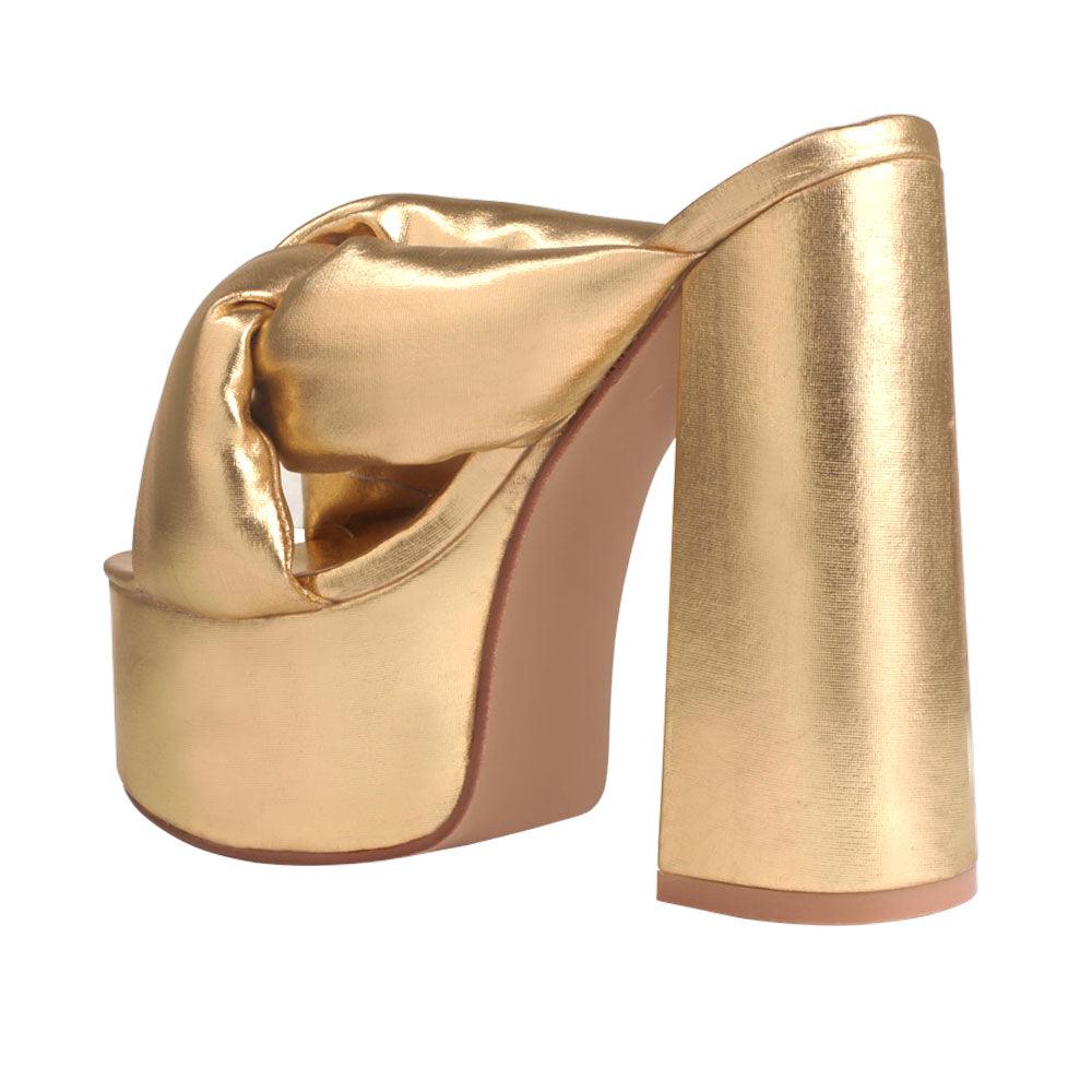 Golden colored fur women platforms-posterior view