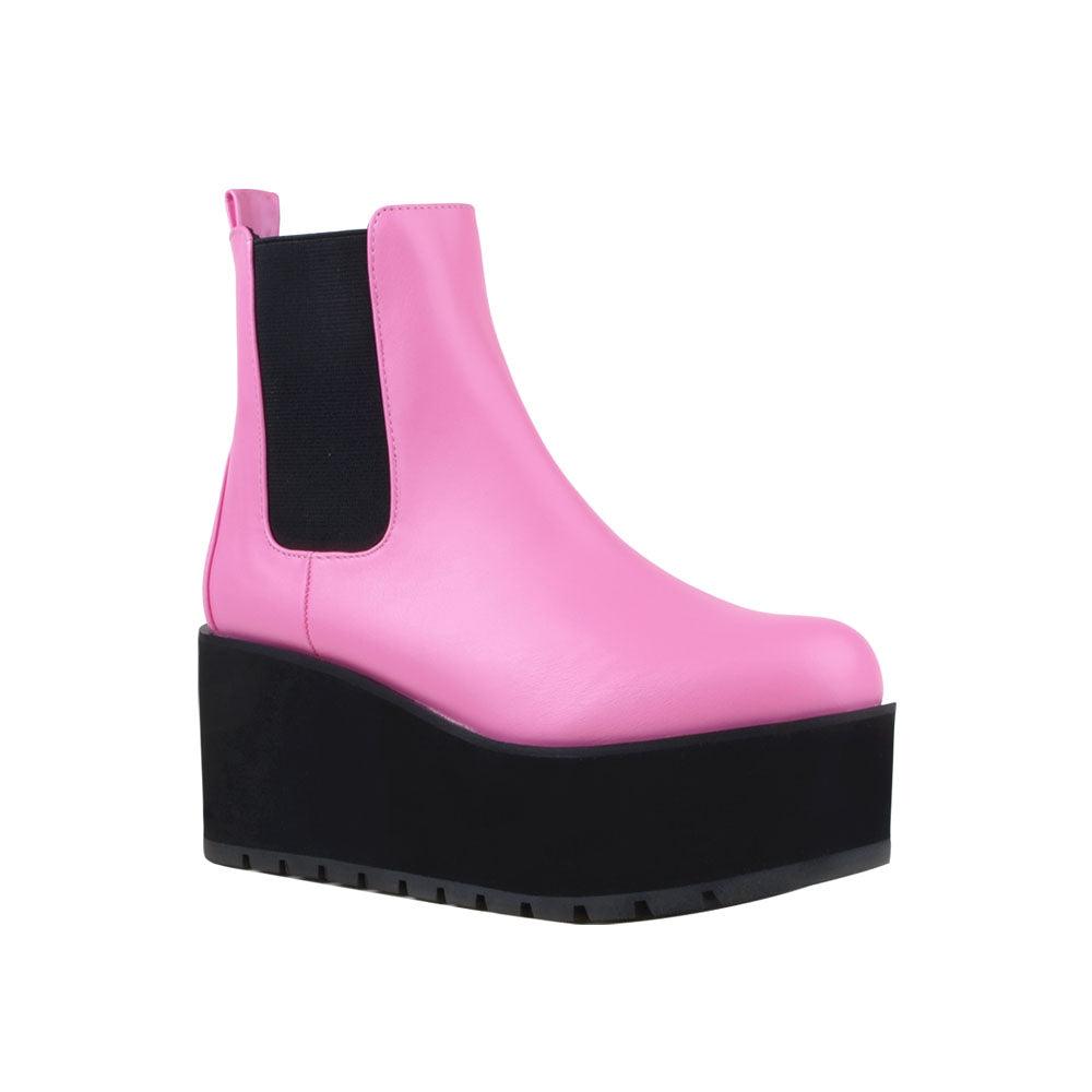 Light pink colored women booties with black platform-corner view