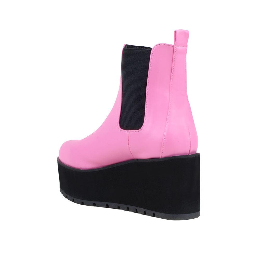 Light pink colored women booties with black platform-posterior view