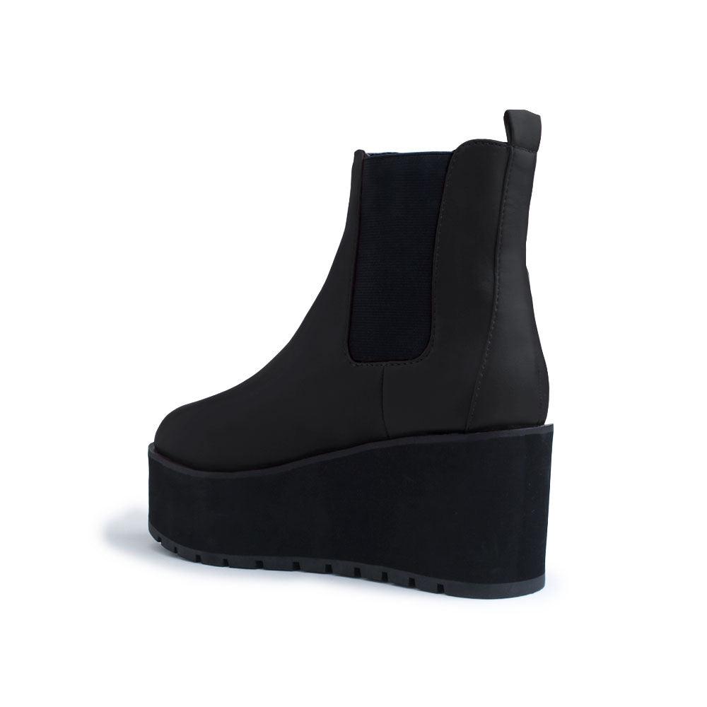 Black colored women booties with black platform-posterior view