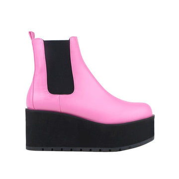 Light pink colored women booties with black platform-side view