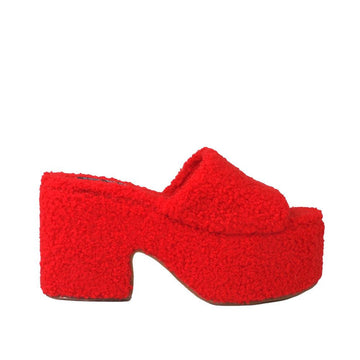 Red colored platforms with slip-on style and furry upper