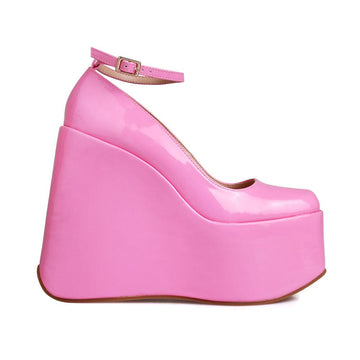 Pink colored platform boots with ankle buckle clasp