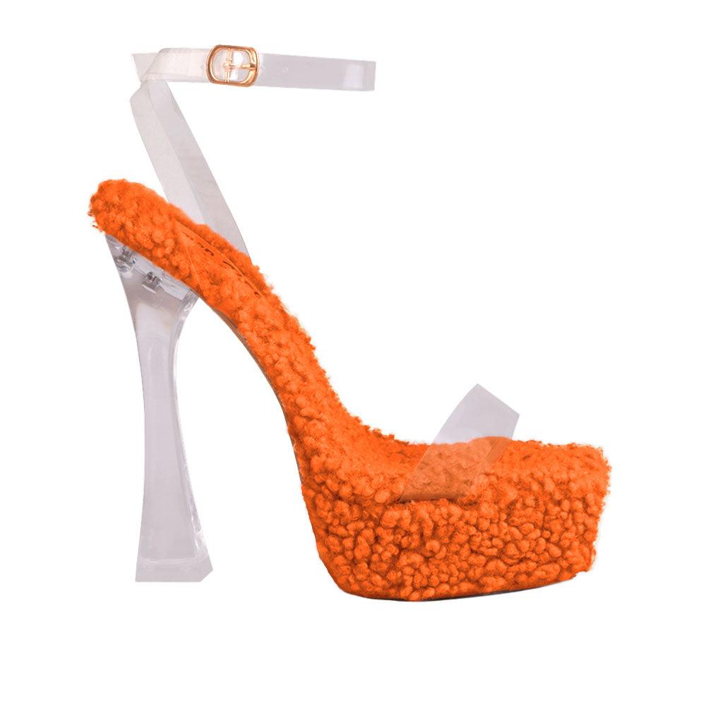 Orange shearling upper and platform heels with ankle clear buckle clasp