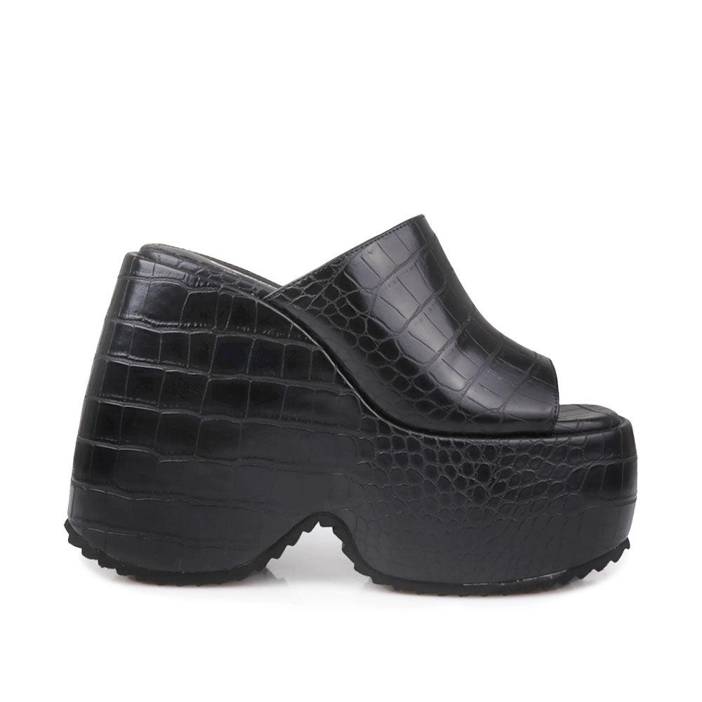 Black platform slippers with slip-on design