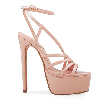 Platforms in nude with stiletto heels, ankle buckle clasp, and tie strap style.