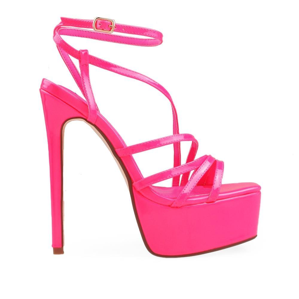 Platforms in pink with stiletto heels, ankle buckle clasp, and tie strap style.