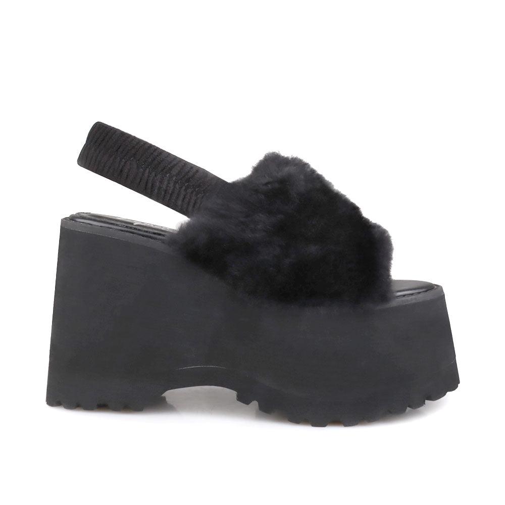 Black colored platforms with fur upper and slip on design