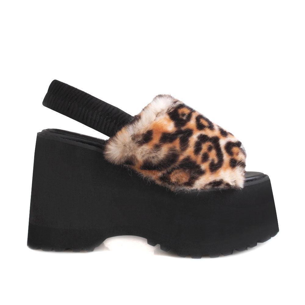 Black colored platforms with leopard pattern fur upper and slip on design