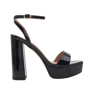 Black platforms with block heels and ankle buckle clasp