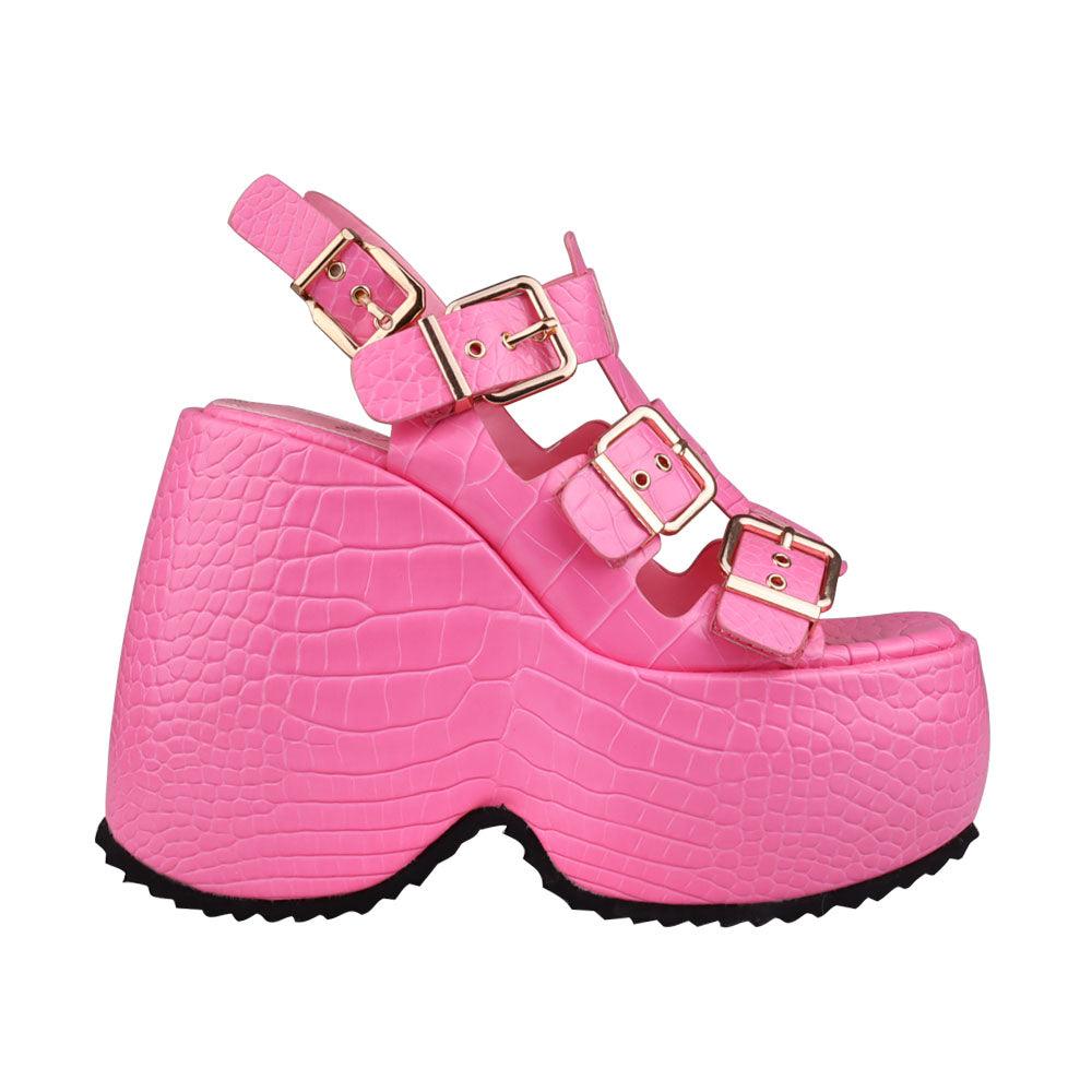 Platforms in pink with buckle strap style and ankle buckle closure