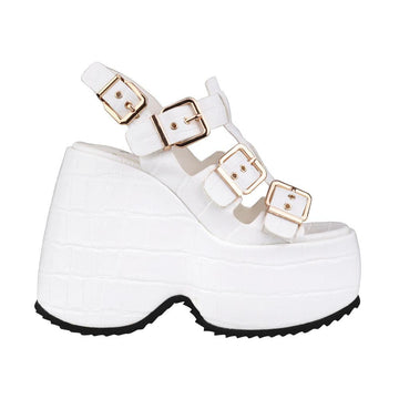 White colored platforms with buckle strap design and ankle buckle closure
