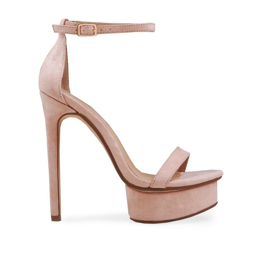 Women's nude heels with an open toe and ankle buck closure.