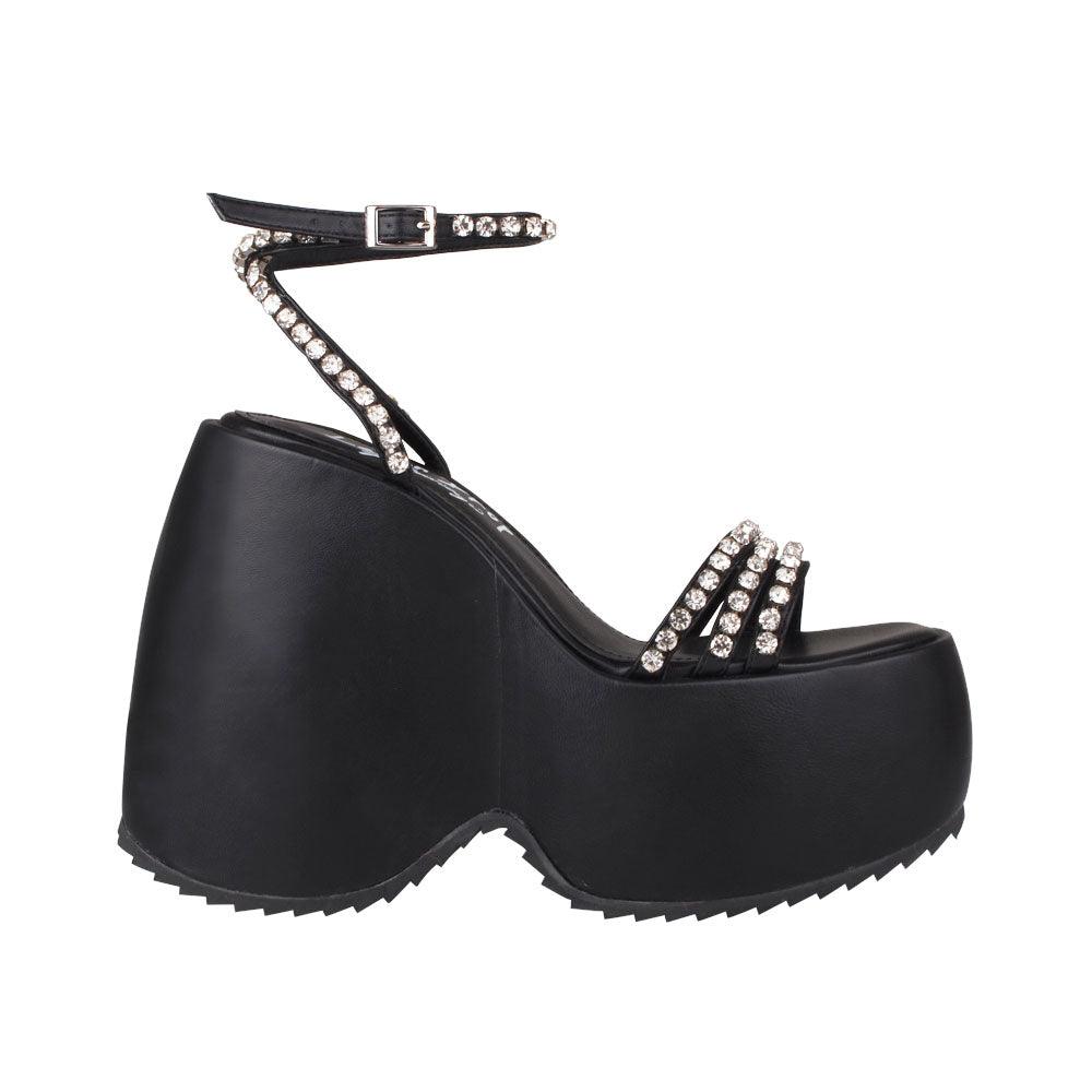 Black platforms with ankle buckle clasp and multiple straps embellished with gems