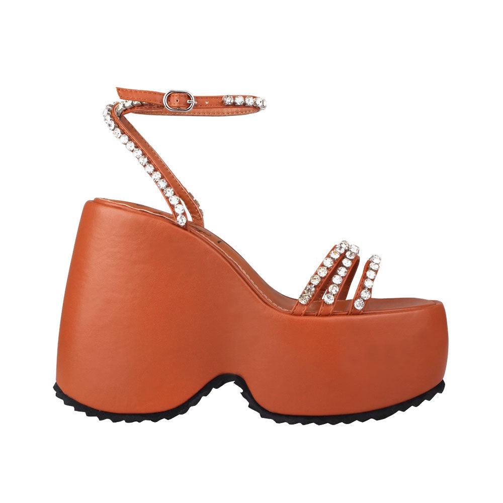 Platforms in cognac with ankle buckle clasp and multiple straps decorated with gems 