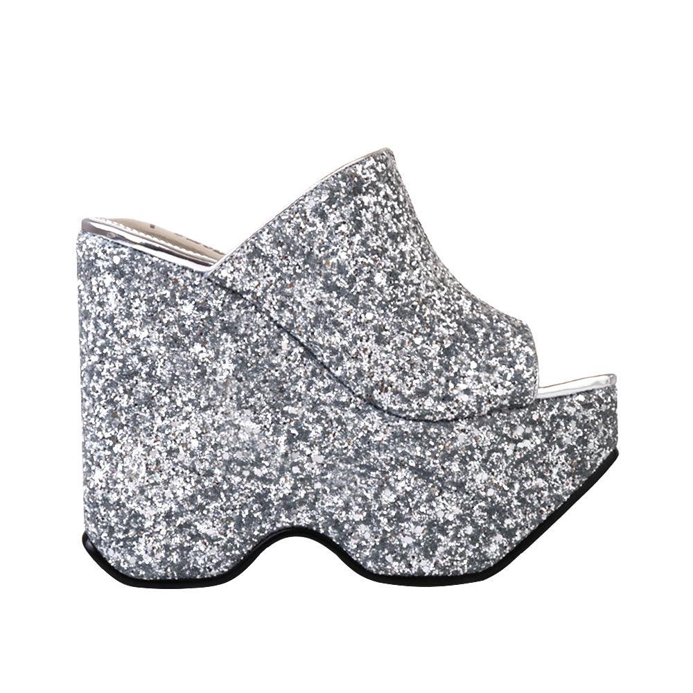 Silver colored platform shoes with slip on design and glittery shine