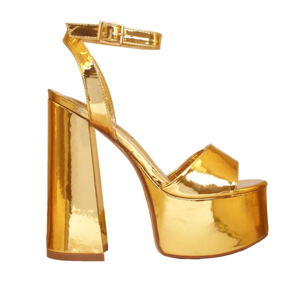 Golden platform slip-on shoes with an ankle buckle fastening