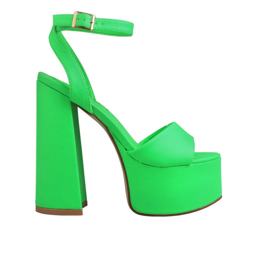 Slip-on neon green platform shoes with ankle buckle clasp and open toe.