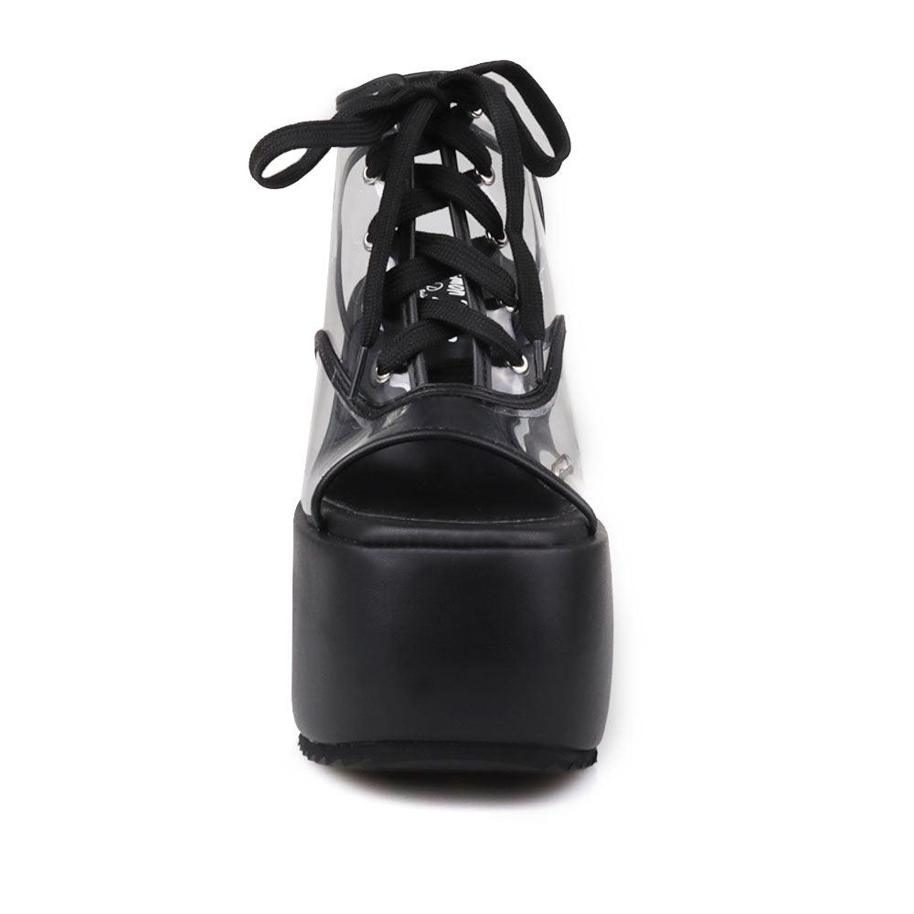 Clear vinyl wedge platform women's shoes in black-front view