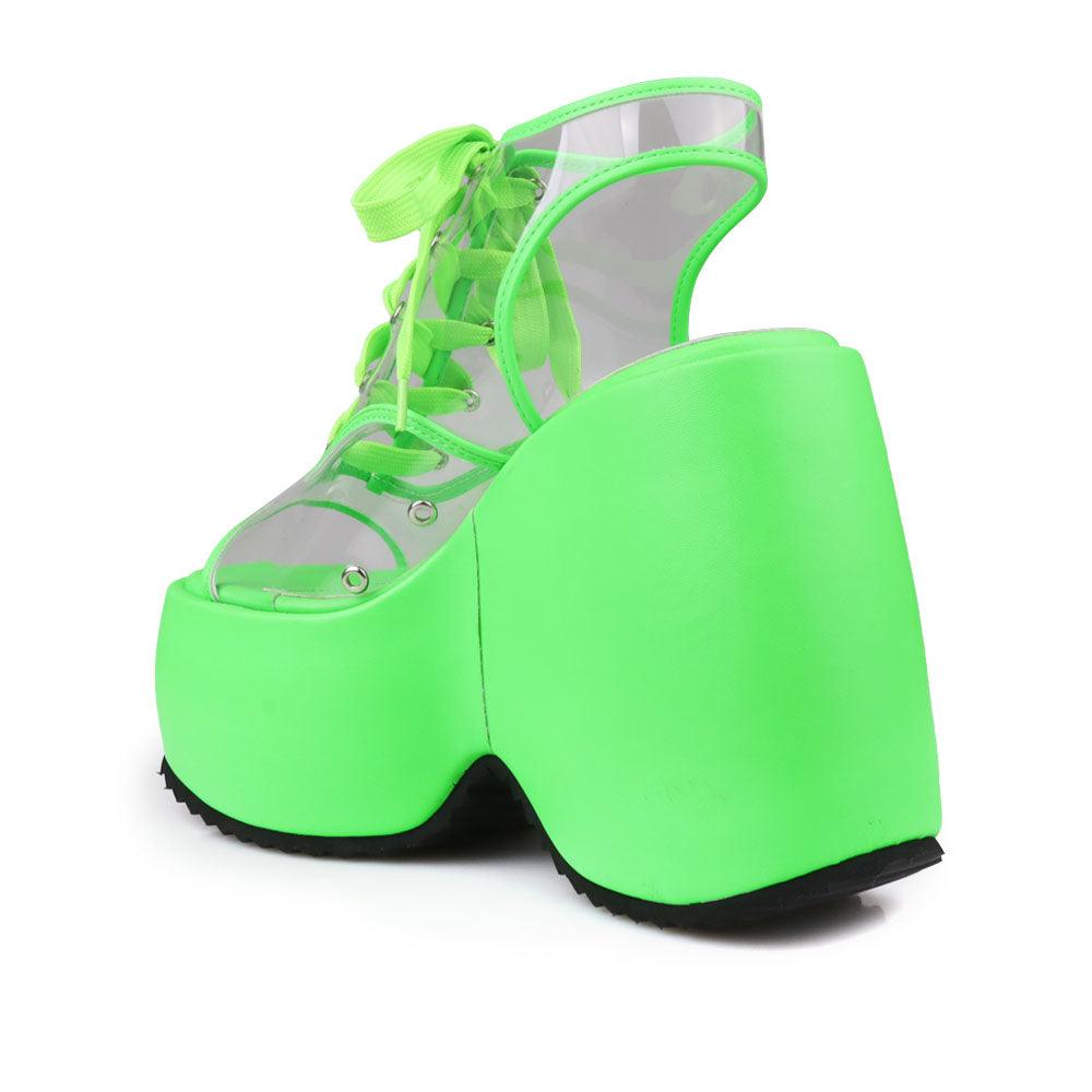 Clear vinyl wedge platform women's shoes in neon green-posterior view