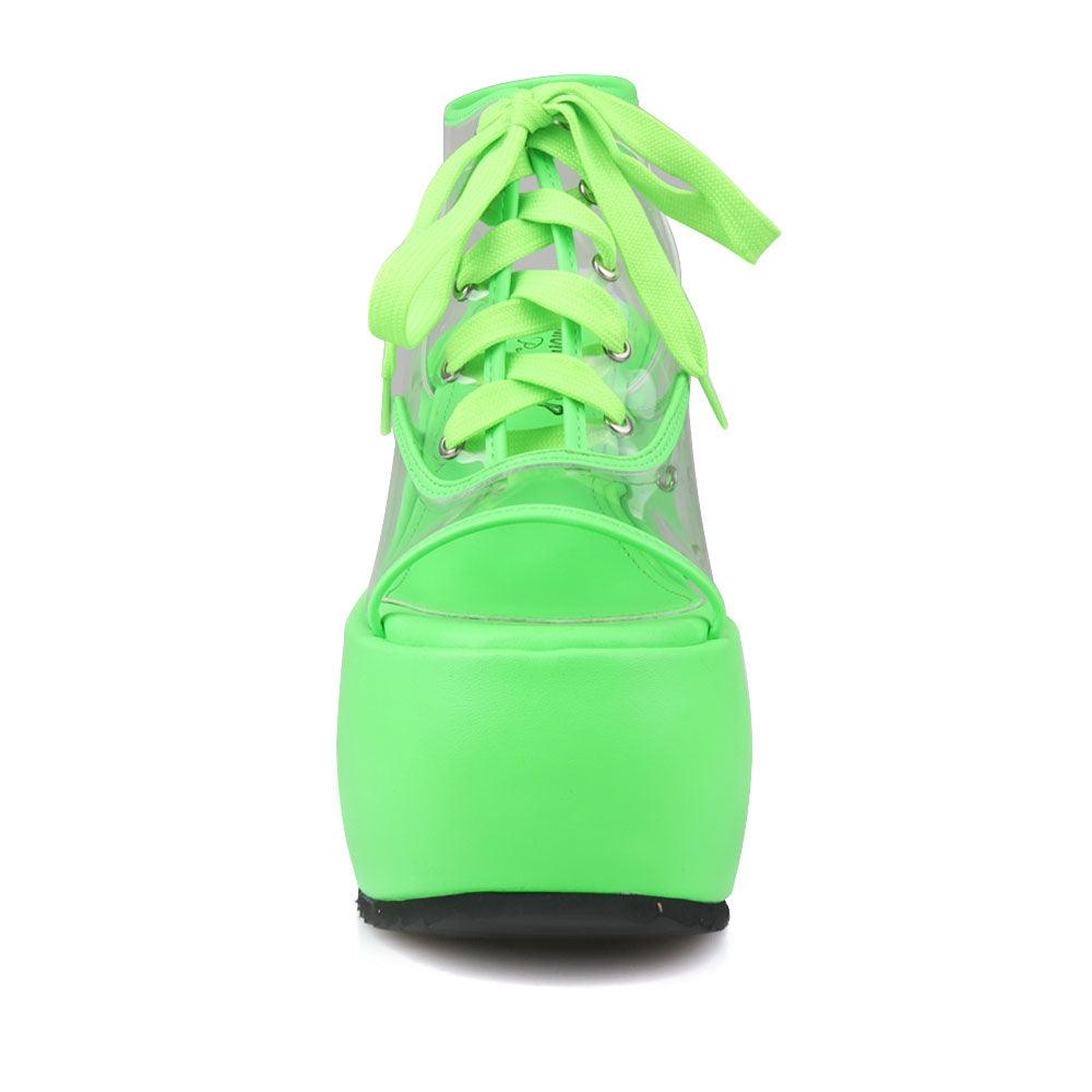 Clear vinyl wedge platform women's shoes in neon green-front view