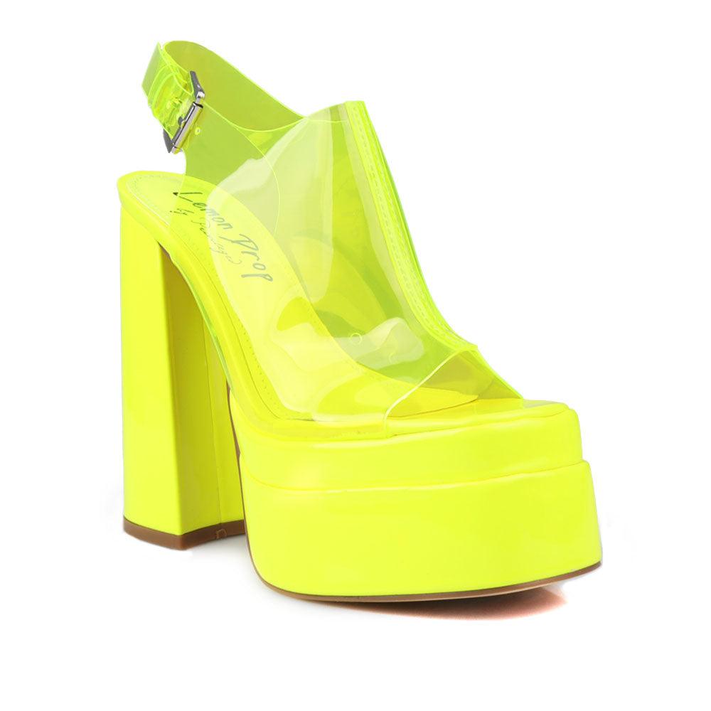 Yellow leather women's platform heels with clear vinyl upper-corner view