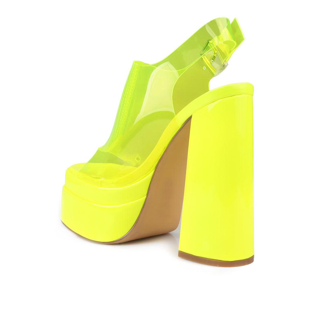 Yellow leather women's platform heels with clear vinyl upper-posterior view