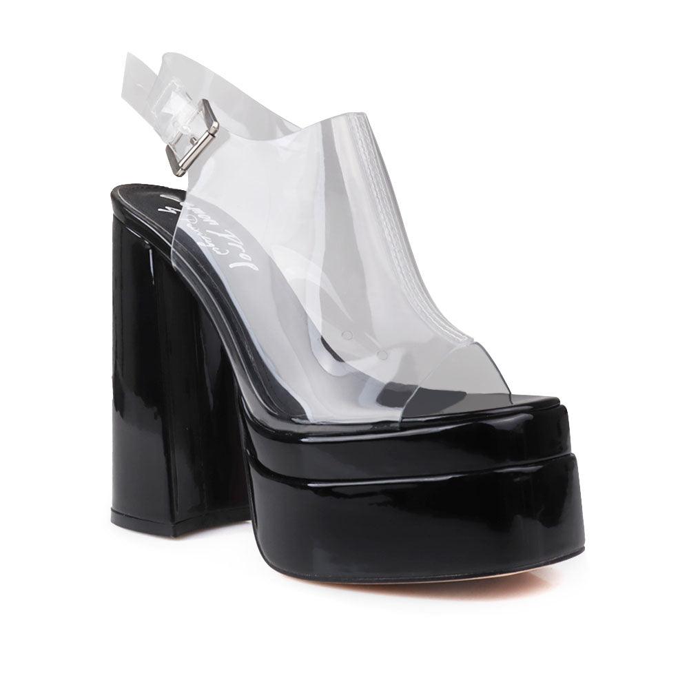 Black leather women's platform heels with clear vinyl upper-corner view