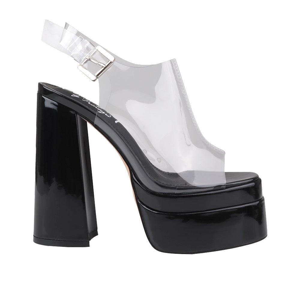 Black leather women's platform heels with clear vinyl upper-side view