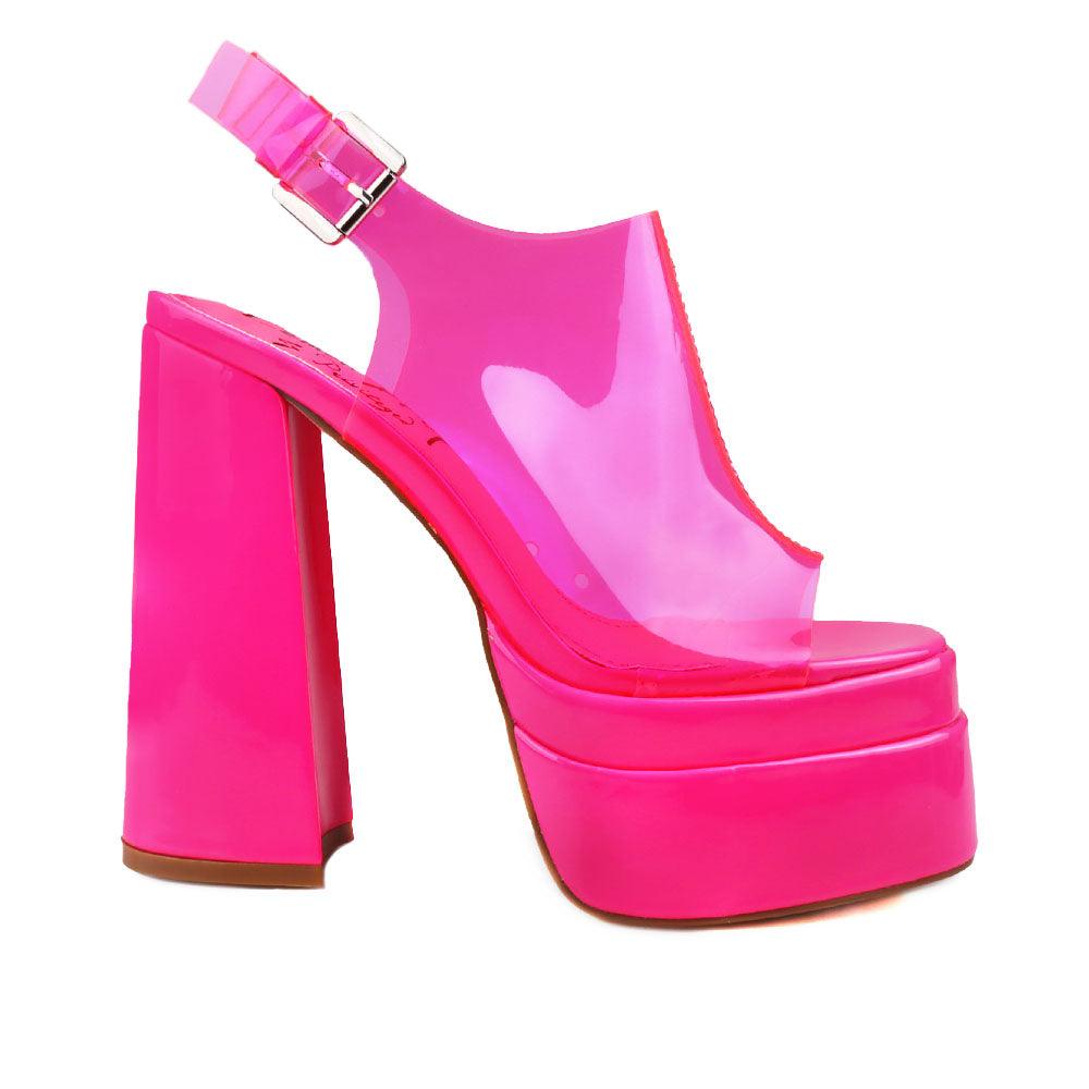 Neon pink leather women's platform heels with clear vinyl upper-side view