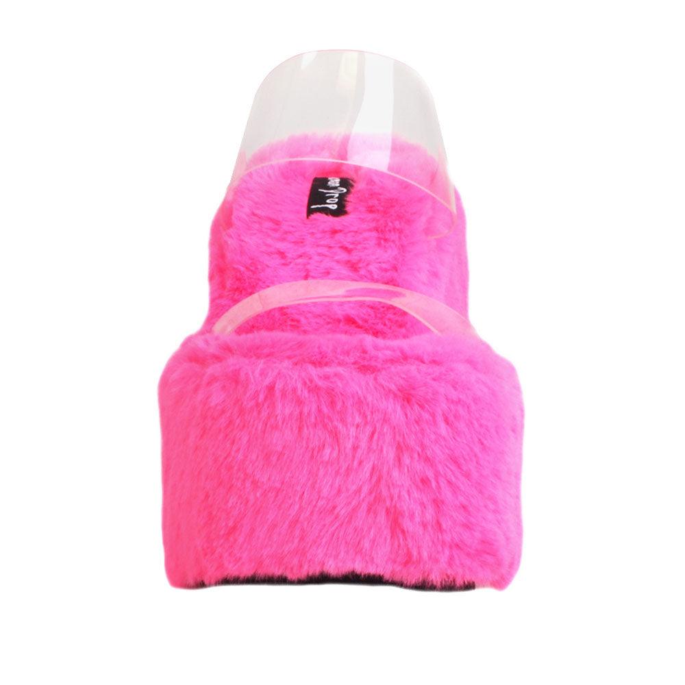 Vinyl upper women's neon pink wedge slip ons covered in fur-front view