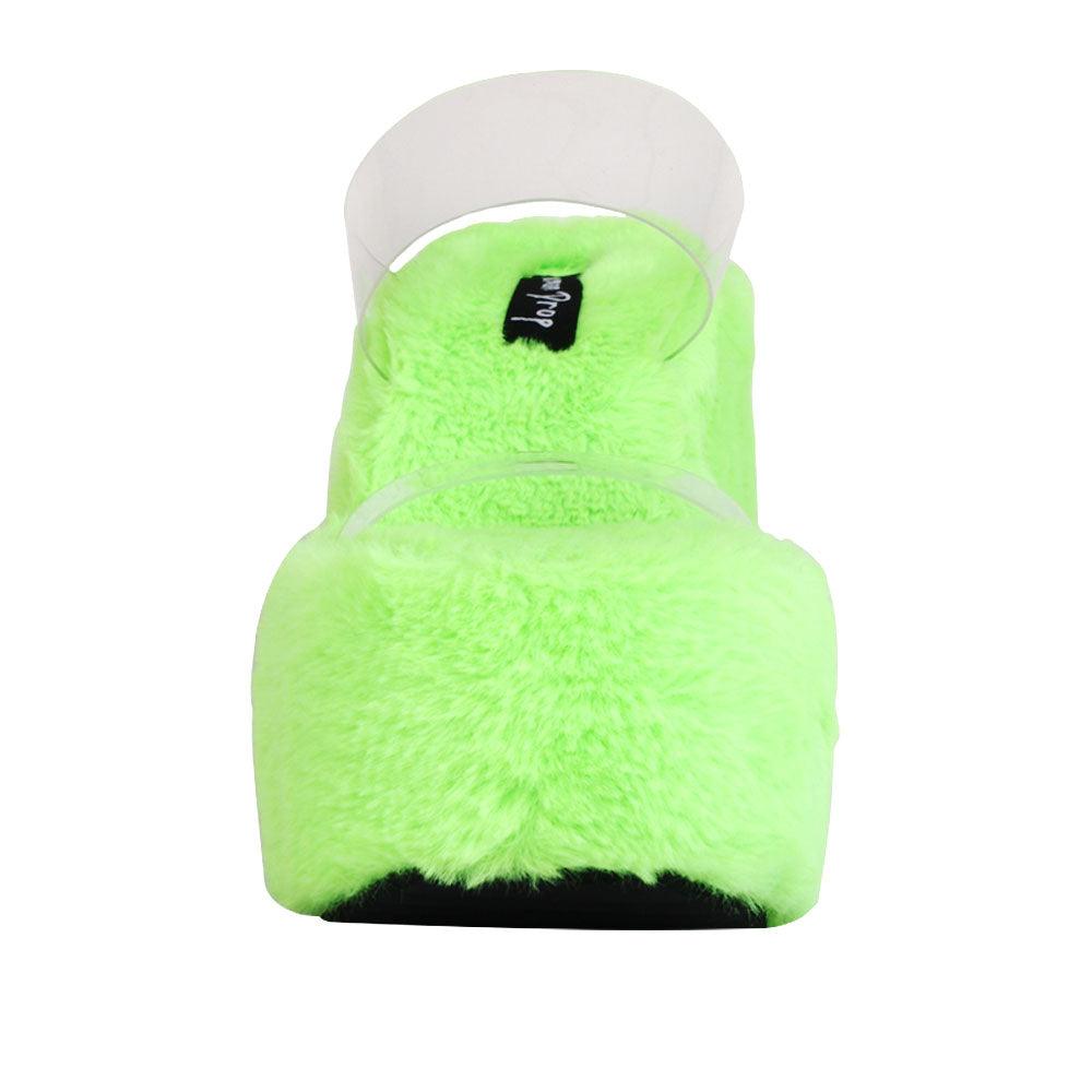 Vinyl upper women's neon green wedge slip ons covered in fur-front view