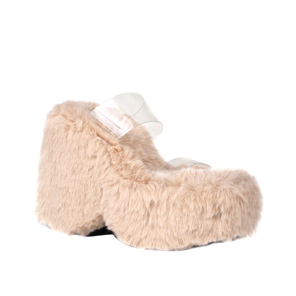 Vinyl upper women's nude wedge slip ons covered in fur-corner view