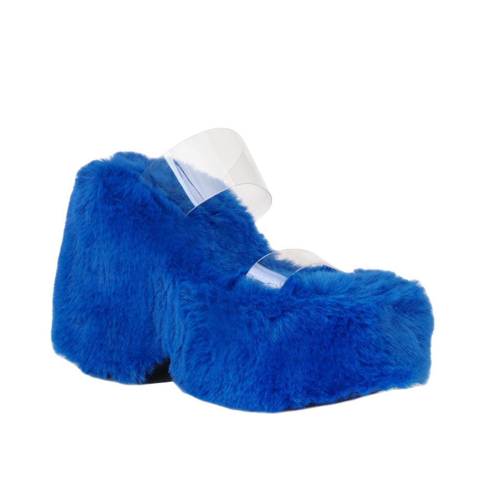 Vinyl upper women's cobalt wedge slip ons covered in fur-corner view