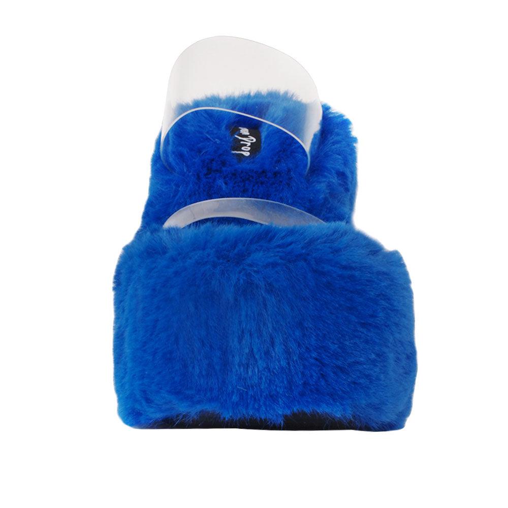 Vinyl upper women's cobalt wedge slip ons covered in fur-front view