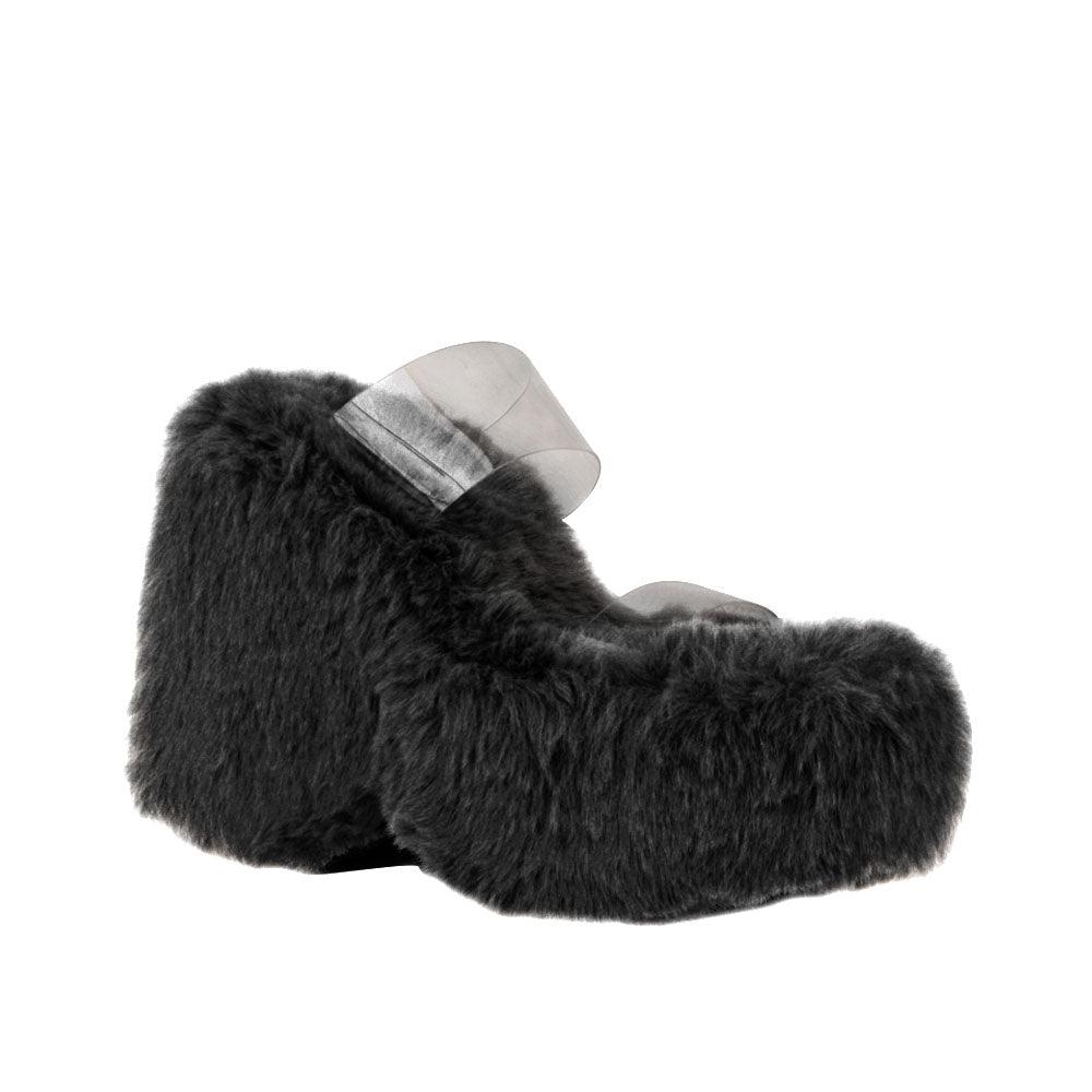 Vinyl upper women's black wedge slip ons covered in fur-corner view