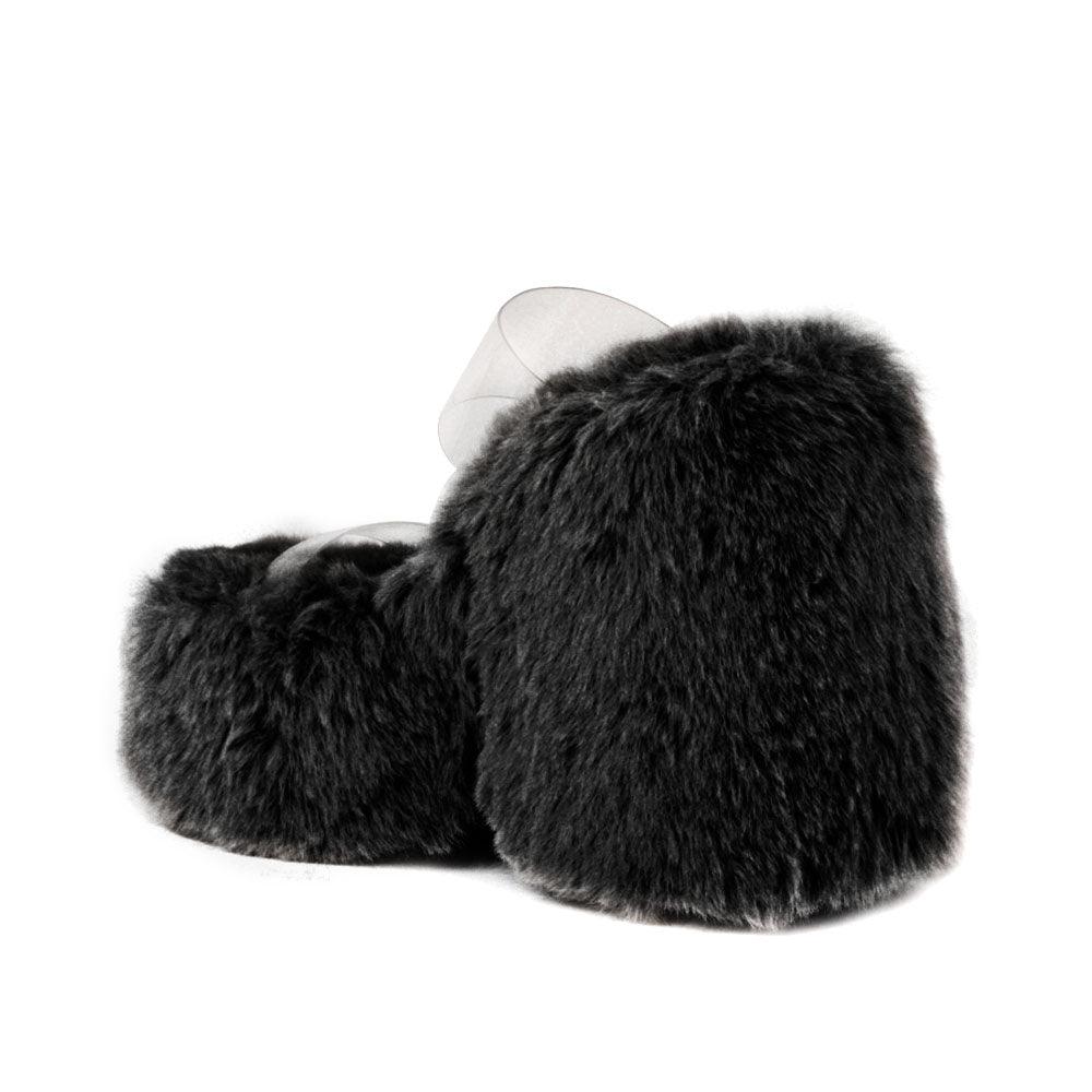 Vinyl upper women's black wedge slip ons covered in fur-posterior view