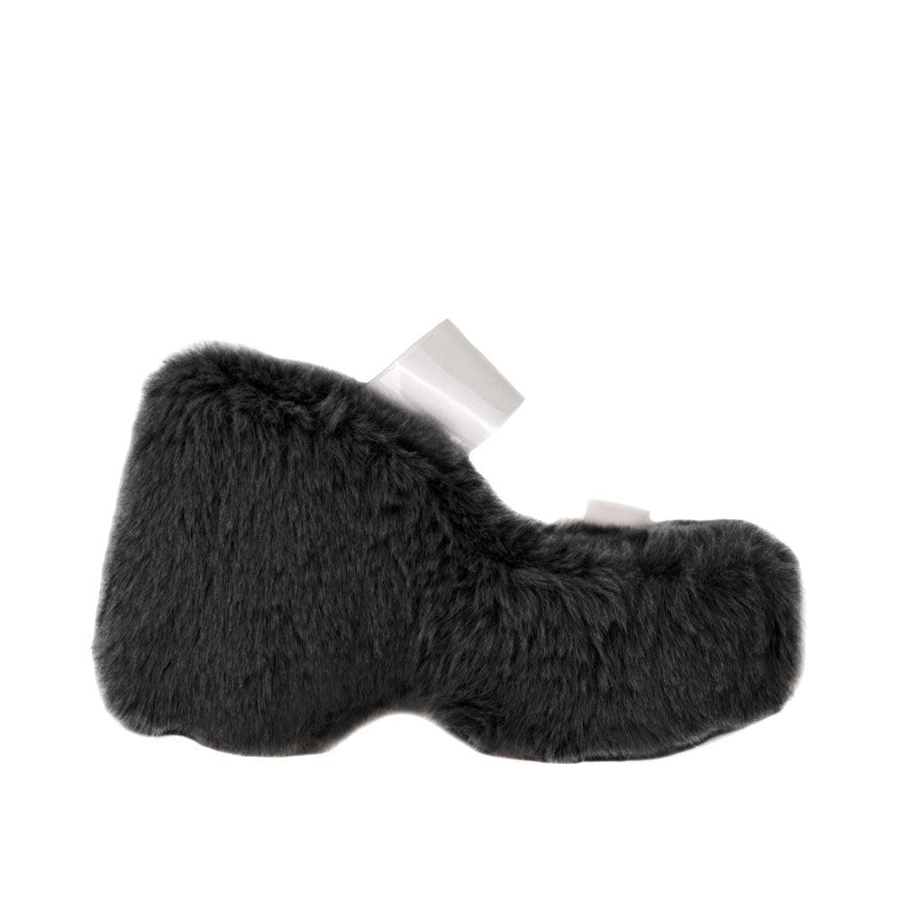 Vinyl upper women's black wedge slip ons covered in fur-side view