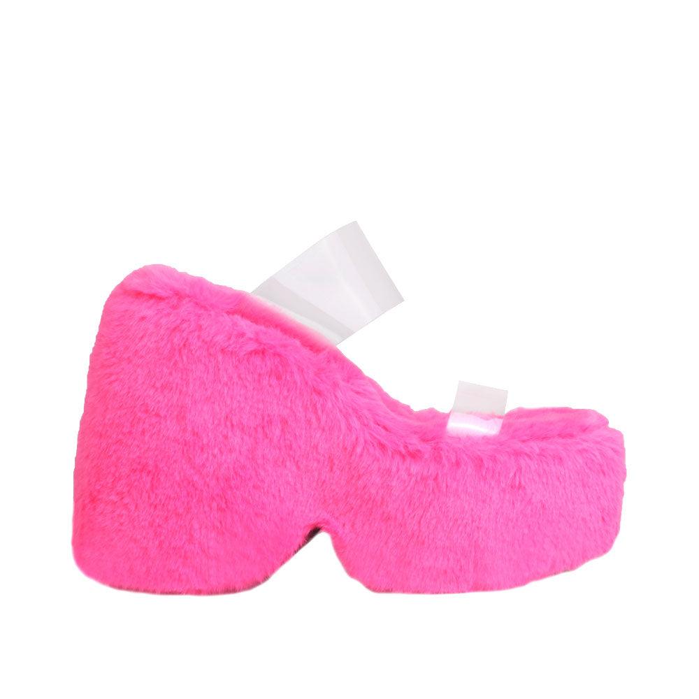 Vinyl upper women's neon pink wedge slip ons covered in fur-side view